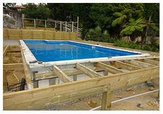 SEMI-ABOVE GROUND POOL TRANSFORMS SLOPING SITE